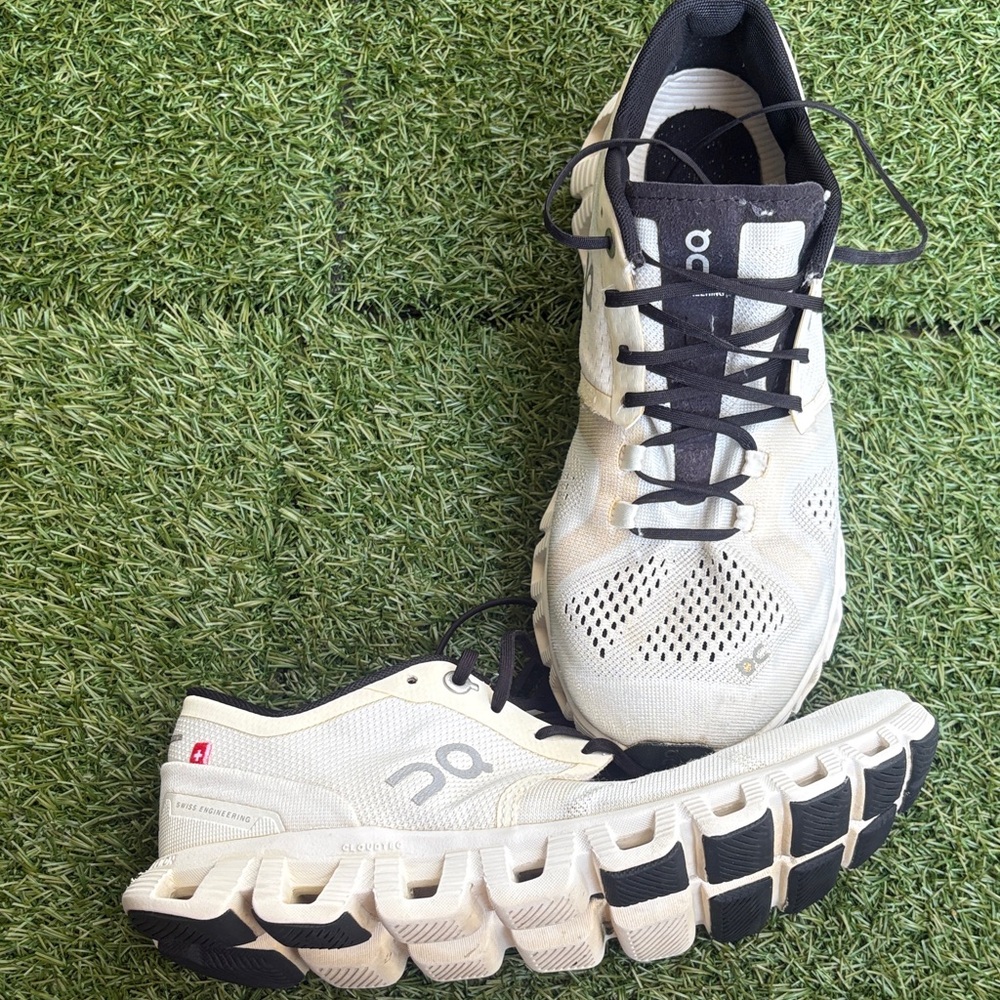 On Running Cream and Black Athletic Shoes
